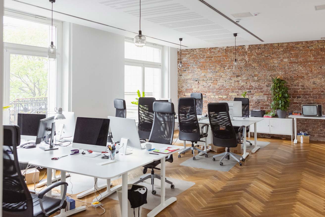 Creative office interior with hardwood floor