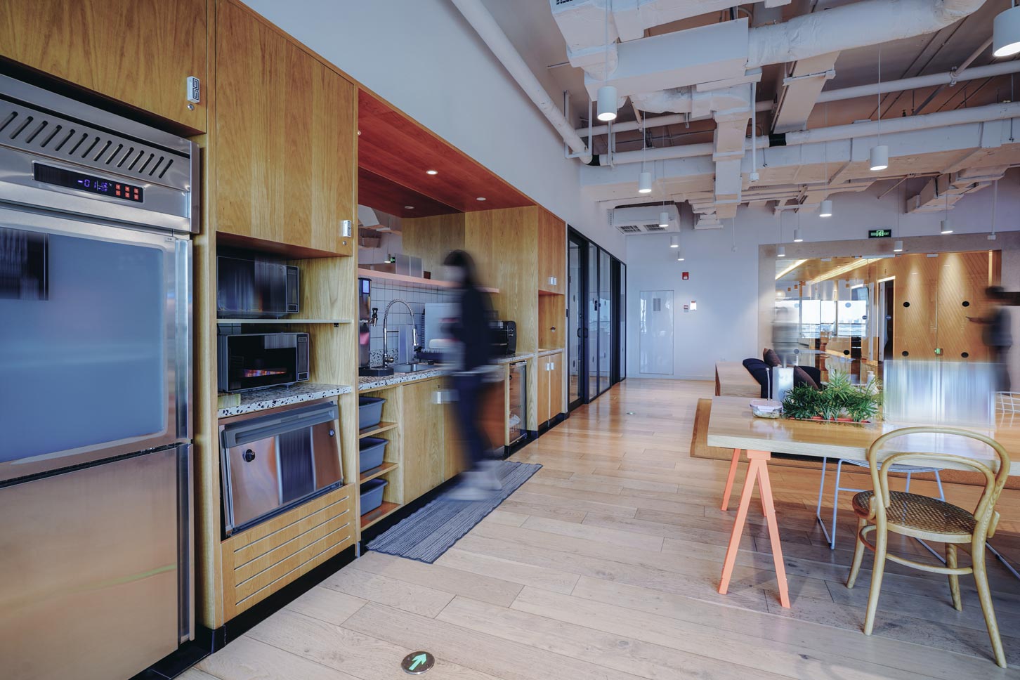 A vibrant and modern co-working space with a mix of comfortable lounge seating and work tables