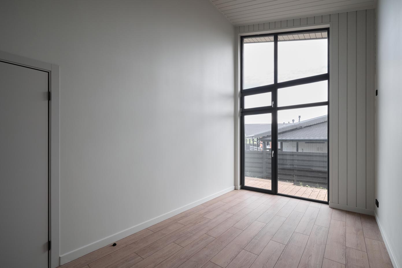 A modern interior space that features large windows allowing for an abundance of natural light