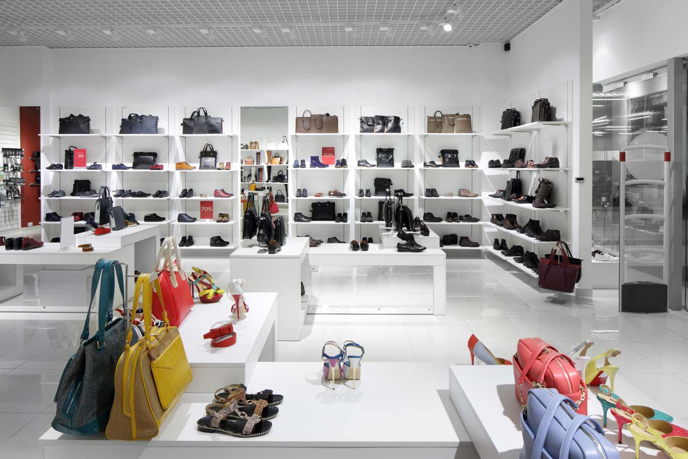 Bright and fashionable interior of shoe store in modern mall